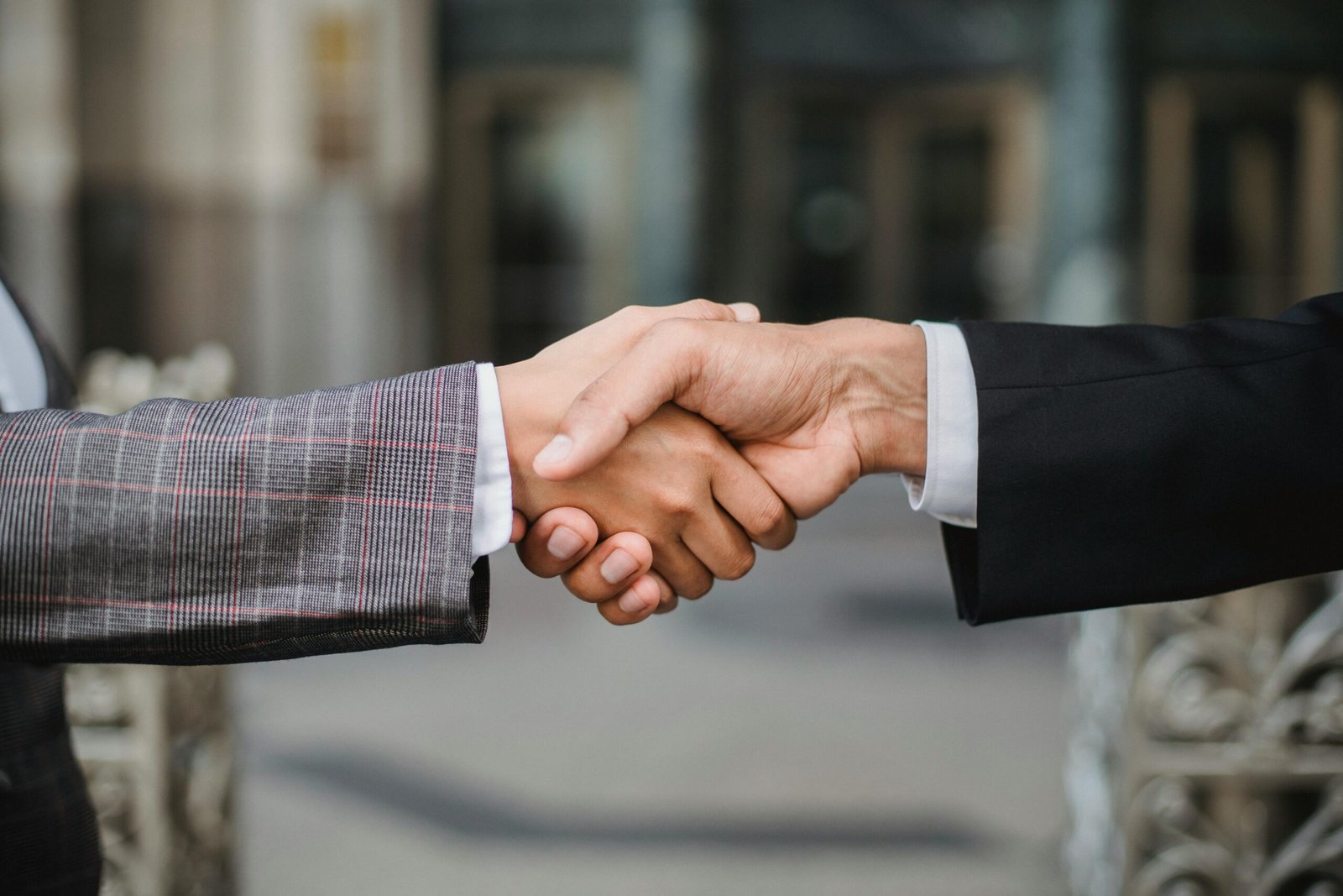 Two business people shaking hands.